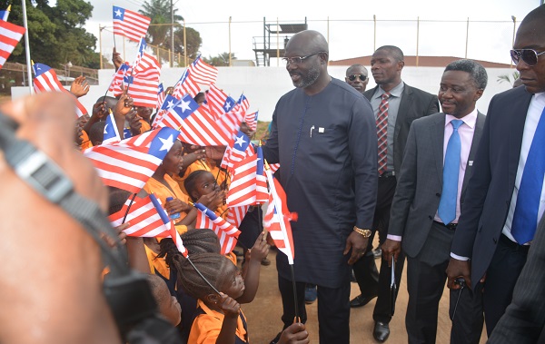 President Weah greeting children from Marshall